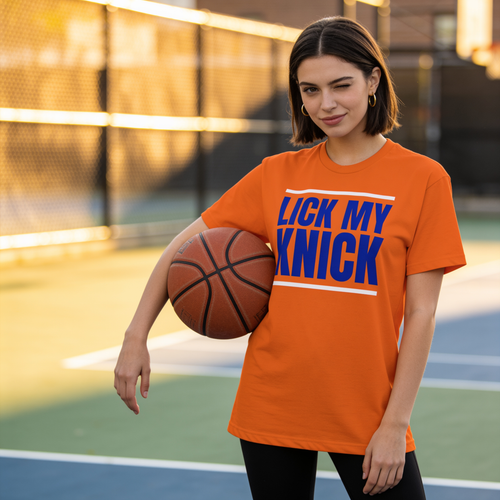 LICK MY KNICK orange tee lifestyle shot at an outdoor basketball court